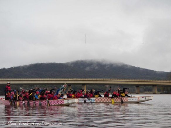 The dragonboaters tearing up the lake.