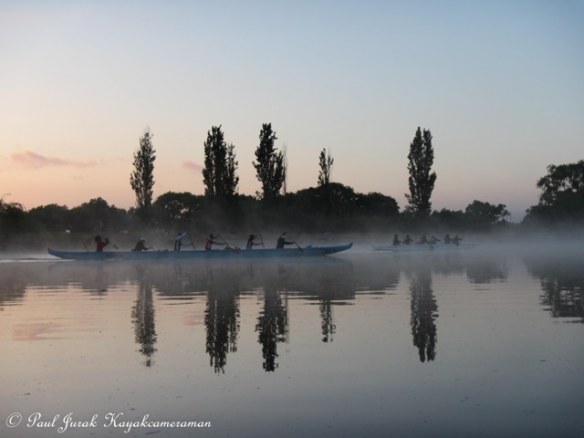 The Ice Dragons Outriggers slicing through the morning mist.