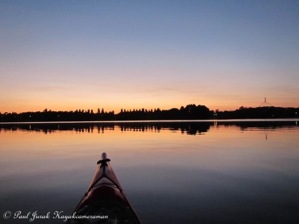 It's 5.04am and I'm slicing through pastel waters.