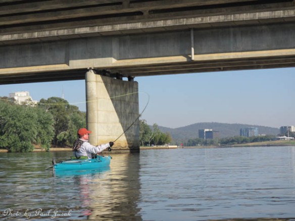 This bloke was even having a fly fish out there. He told me that he latched onto a big carp and it dragged him down towards the Carillon. 
